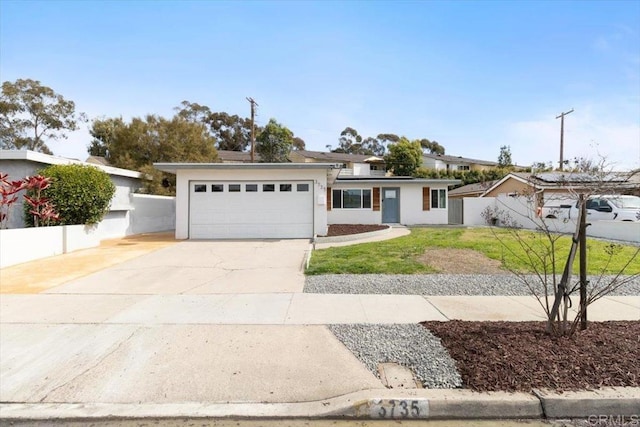 3735 Budd St, San Diego, CA 92111 - view of front facade with fence, roof mounted solar panels, a garage, concrete driveway, and stucco siding