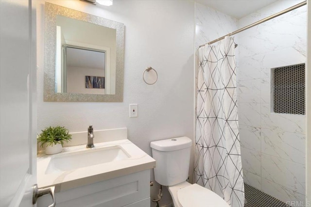 3735 Budd St, San Diego, CA 92111 - full bathroom with a tile shower, toilet, and vanity