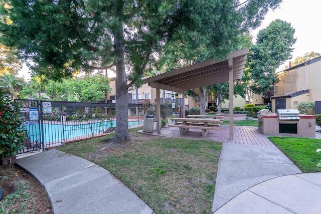 view of community featuring fence and a pool