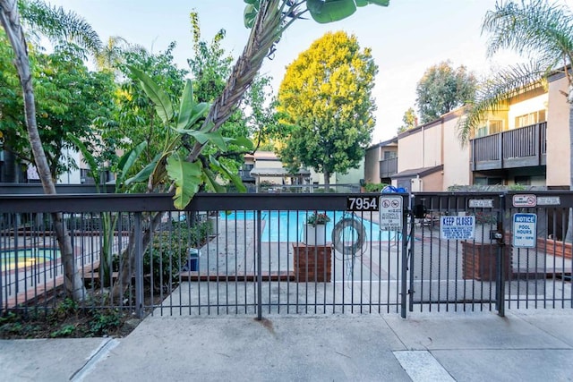 view of gate with fence