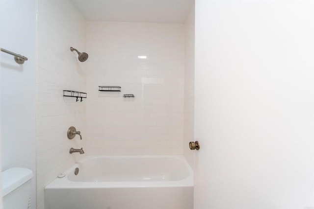 bathroom with shower / tub combination and toilet