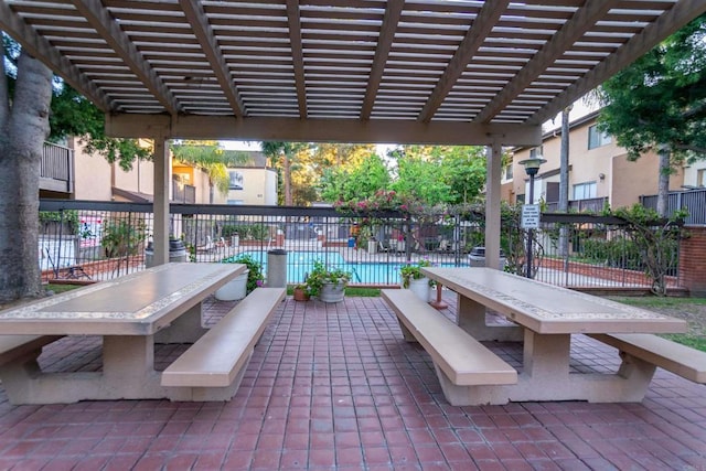 view of patio / terrace with fence and a pergola