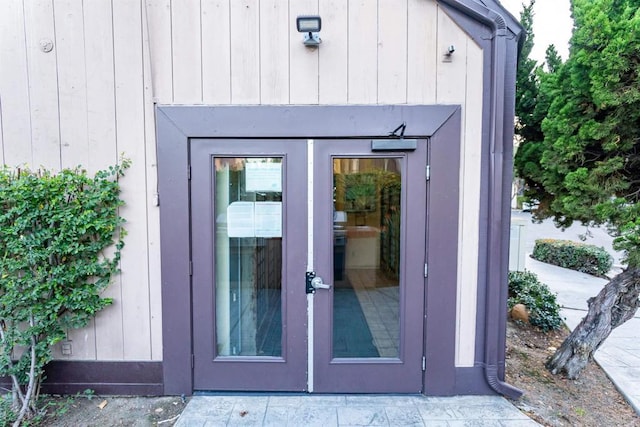 view of exterior entry featuring board and batten siding