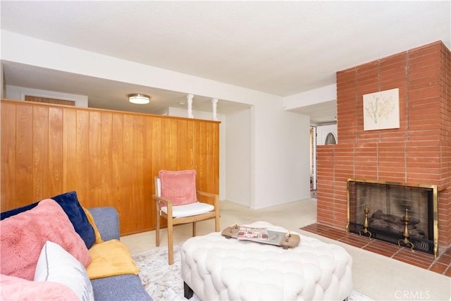 living room with a brick fireplace