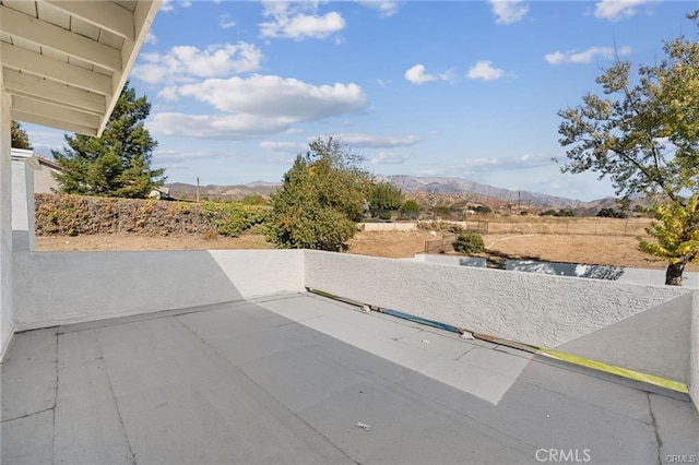 view of patio / terrace featuring a mountain view