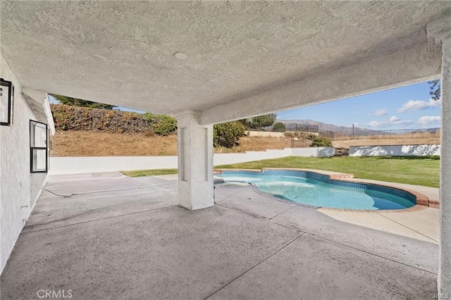 view of pool with a yard, a patio area, fence private yard, and a fenced in pool