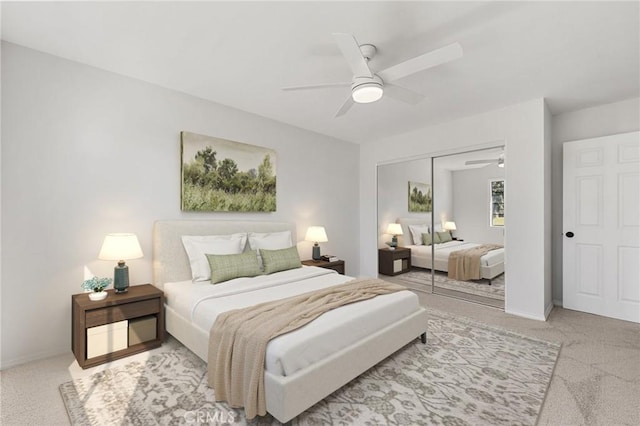 carpeted bedroom with a closet, a ceiling fan, and baseboards