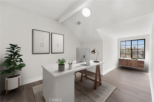 office space featuring lofted ceiling with beams, wood finished floors, visible vents, and baseboards