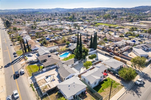 drone / aerial view featuring a residential view and a mountain view