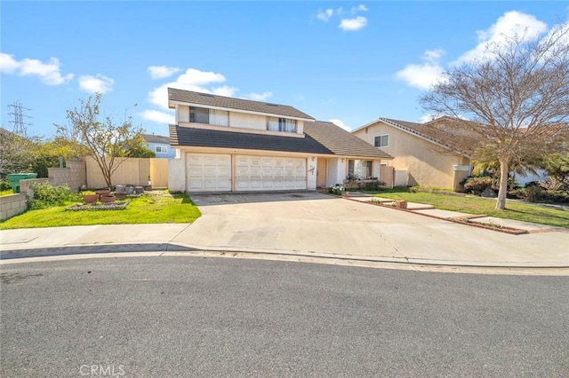 traditional-style home with fence, a front lawn, concrete driveway, and stucco siding