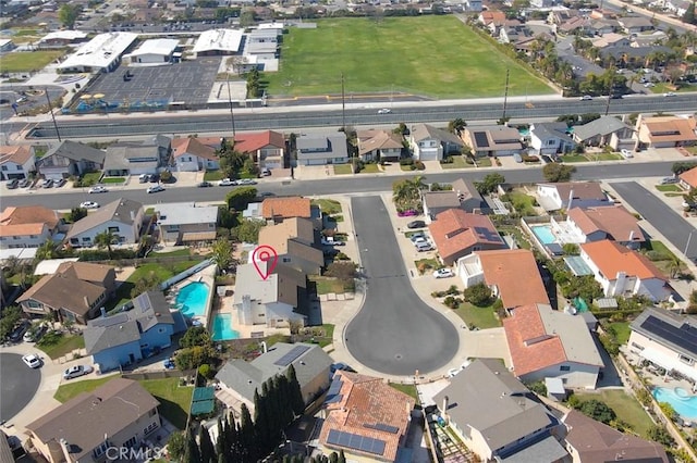 birds eye view of property with a residential view