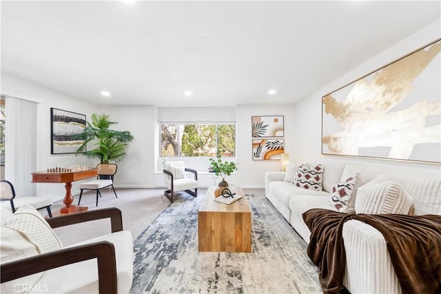 living room featuring plenty of natural light, recessed lighting, carpet floors, and baseboards