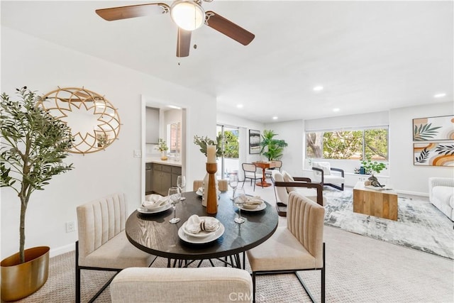 carpeted dining area with ceiling fan, recessed lighting, and baseboards
