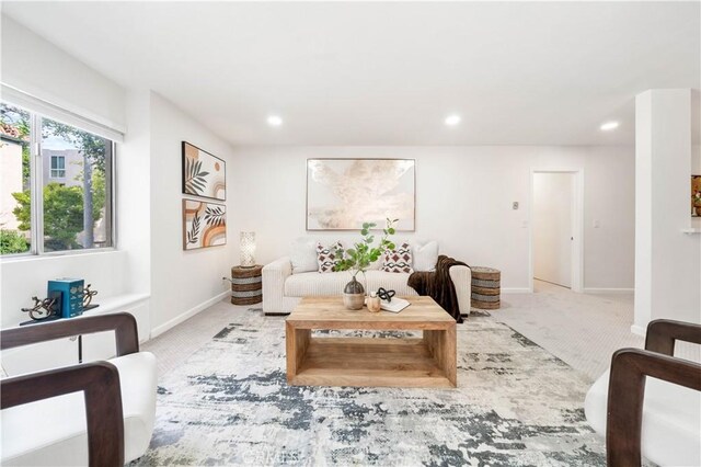 living room with carpet flooring, baseboards, and recessed lighting