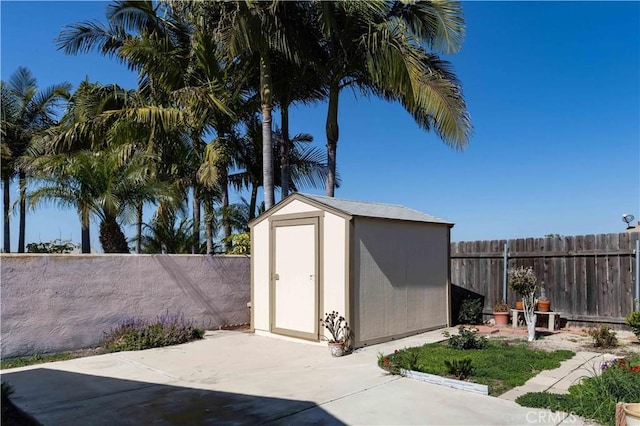 view of shed featuring a fenced backyard