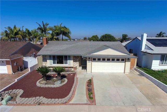 ranch-style house featuring an attached garage, driveway, stone siding, a gate, and a chimney