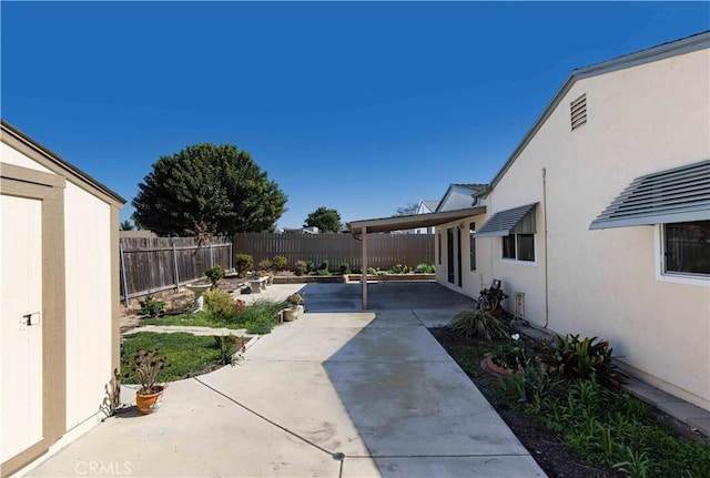 view of yard featuring a patio area and a fenced backyard