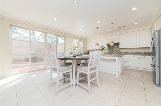 dining room featuring recessed lighting and light tile patterned floors