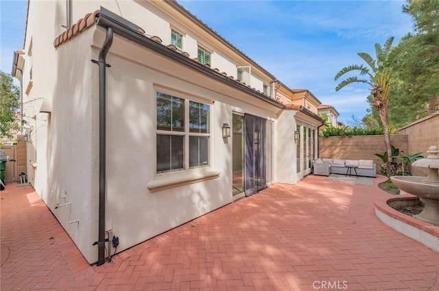 exterior space with fence and an outdoor hangout area