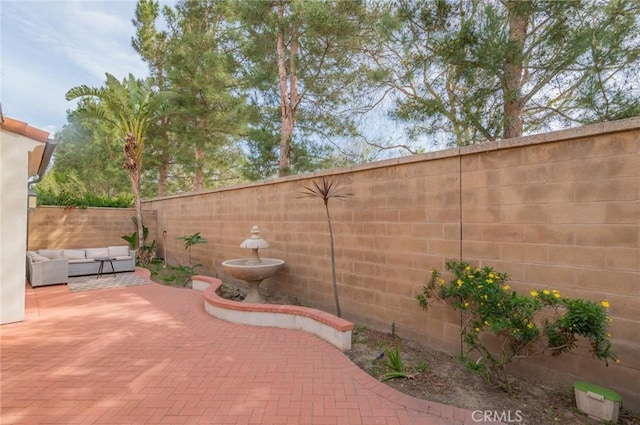 view of patio featuring an outdoor hangout area and a fenced backyard