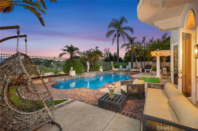 view of swimming pool featuring a patio area, a fenced backyard, outdoor lounge area, and a fenced in pool