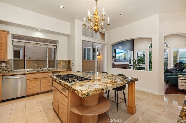 kitchen featuring light tile patterned floors, stainless steel appliances, tasteful backsplash, and light stone counters