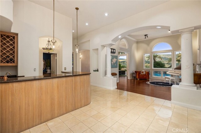 reception area with ornate columns, arched walkways, and a sink