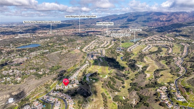 birds eye view of property with a water and mountain view