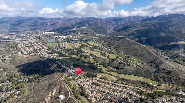 birds eye view of property featuring a mountain view