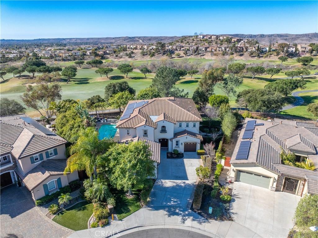 bird's eye view with a residential view, a mountain view, and golf course view