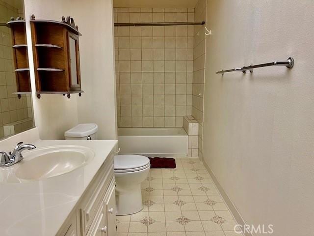 bathroom with toilet, bathing tub / shower combination, baseboards, and vanity