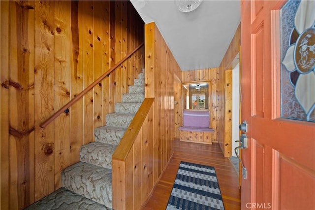 interior space with wood walls and wood finished floors