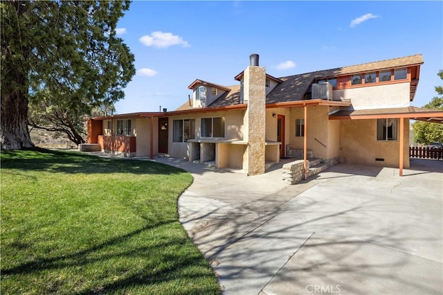 rear view of property with a yard, a patio, stucco siding, crawl space, and central AC