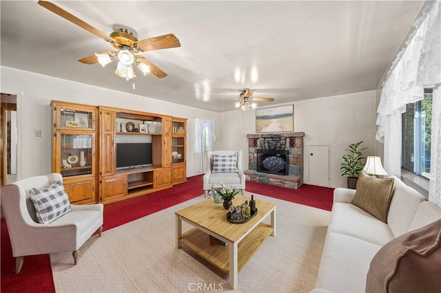 31251 Aliso Canyon Rd, Acton, CA 93550 - living area featuring carpet, a ceiling fan, and a stone fireplace
