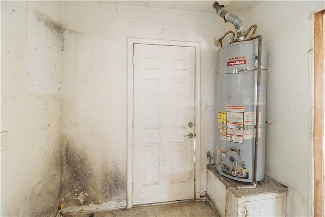 utility room featuring gas water heater