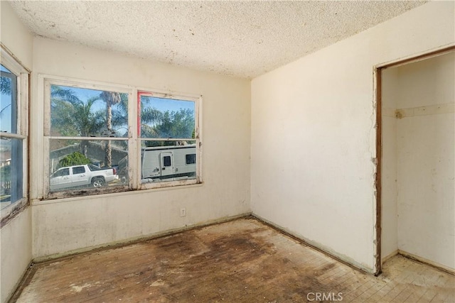 empty room featuring a textured ceiling