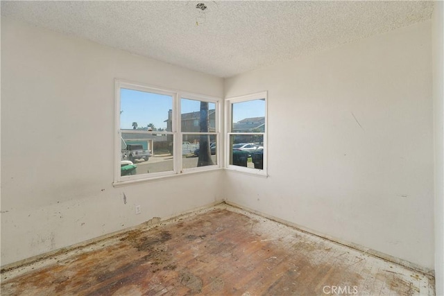 spare room featuring a textured ceiling