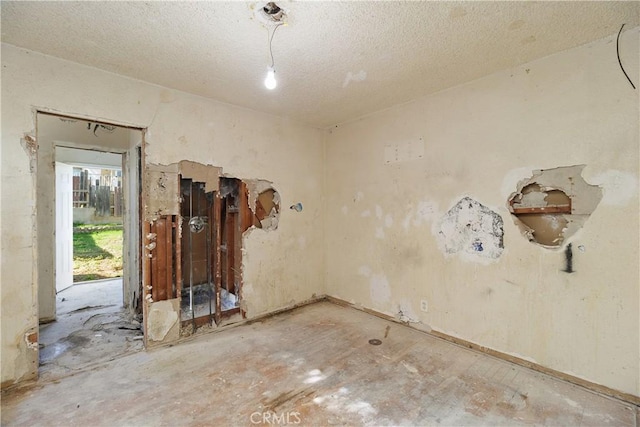 empty room with a textured ceiling