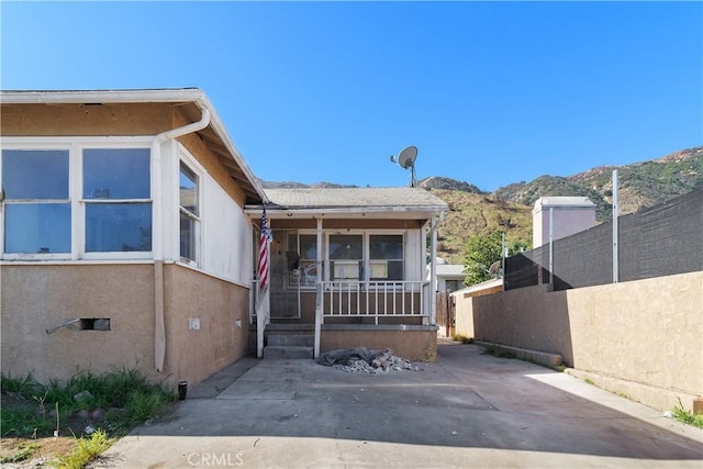 view of front of property featuring a porch and stucco siding