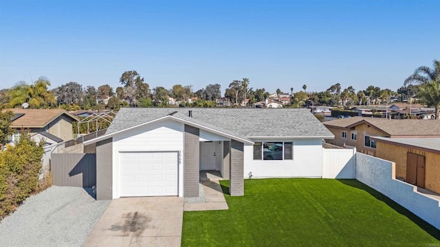 view of front of property with a garage, a shingled roof, fence, concrete driveway, and a front lawn