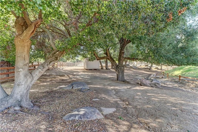 41215 Avenida De Los Posas, Murrieta, CA 92562 - view of yard featuring a shed, an outbuilding, and fence
