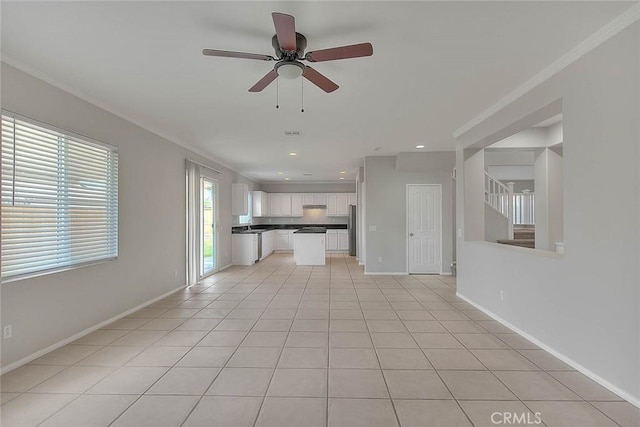 unfurnished living room with recessed lighting, stairway, a ceiling fan, light tile patterned flooring, and baseboards