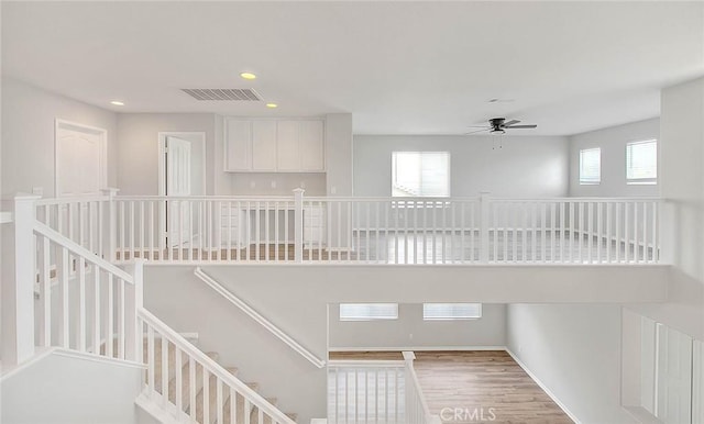 interior space featuring ceiling fan, recessed lighting, wood finished floors, visible vents, and baseboards