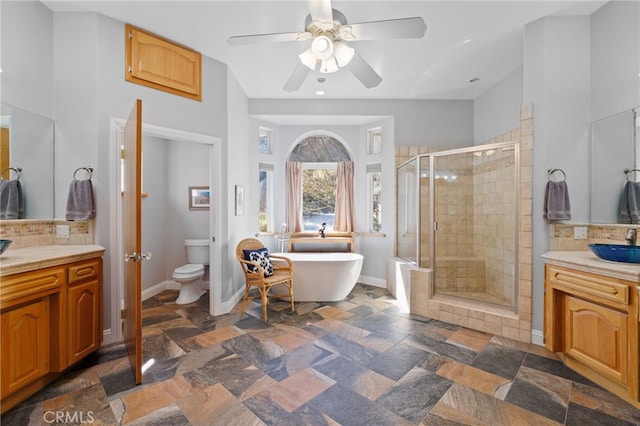 848 Burlando Rd, Kernville, CA 93238 - bathroom with a shower stall, vanity, ceiling fan, a soaking tub, and backsplash