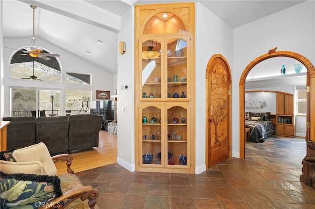 848 Burlando Rd, Kernville, CA 93238 - hallway featuring vaulted ceiling, stone tile flooring, and baseboards
