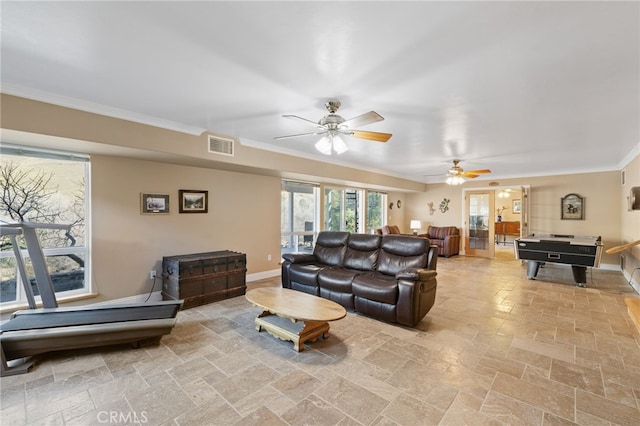 848 Burlando Rd, Kernville, CA 93238 - living room featuring stone tile flooring, baseboards, visible vents, ceiling fan, and ornamental molding