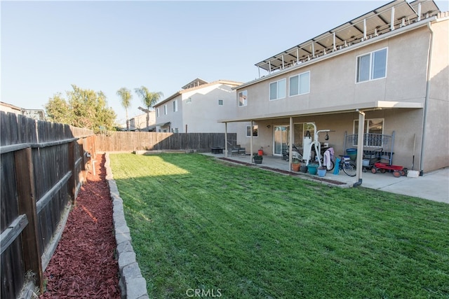 view of yard with a fenced backyard and a patio