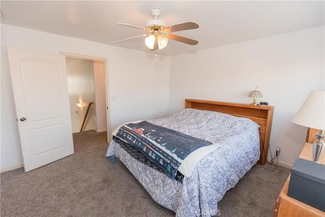 bedroom featuring a ceiling fan, carpet, and baseboards