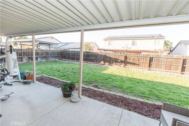 view of yard featuring a patio area and a fenced backyard