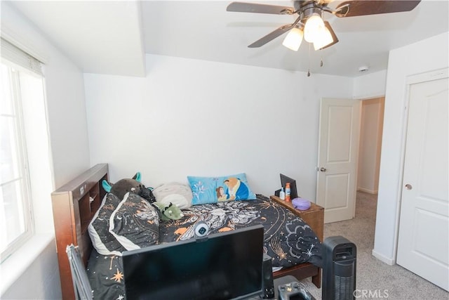 carpeted bedroom with a ceiling fan